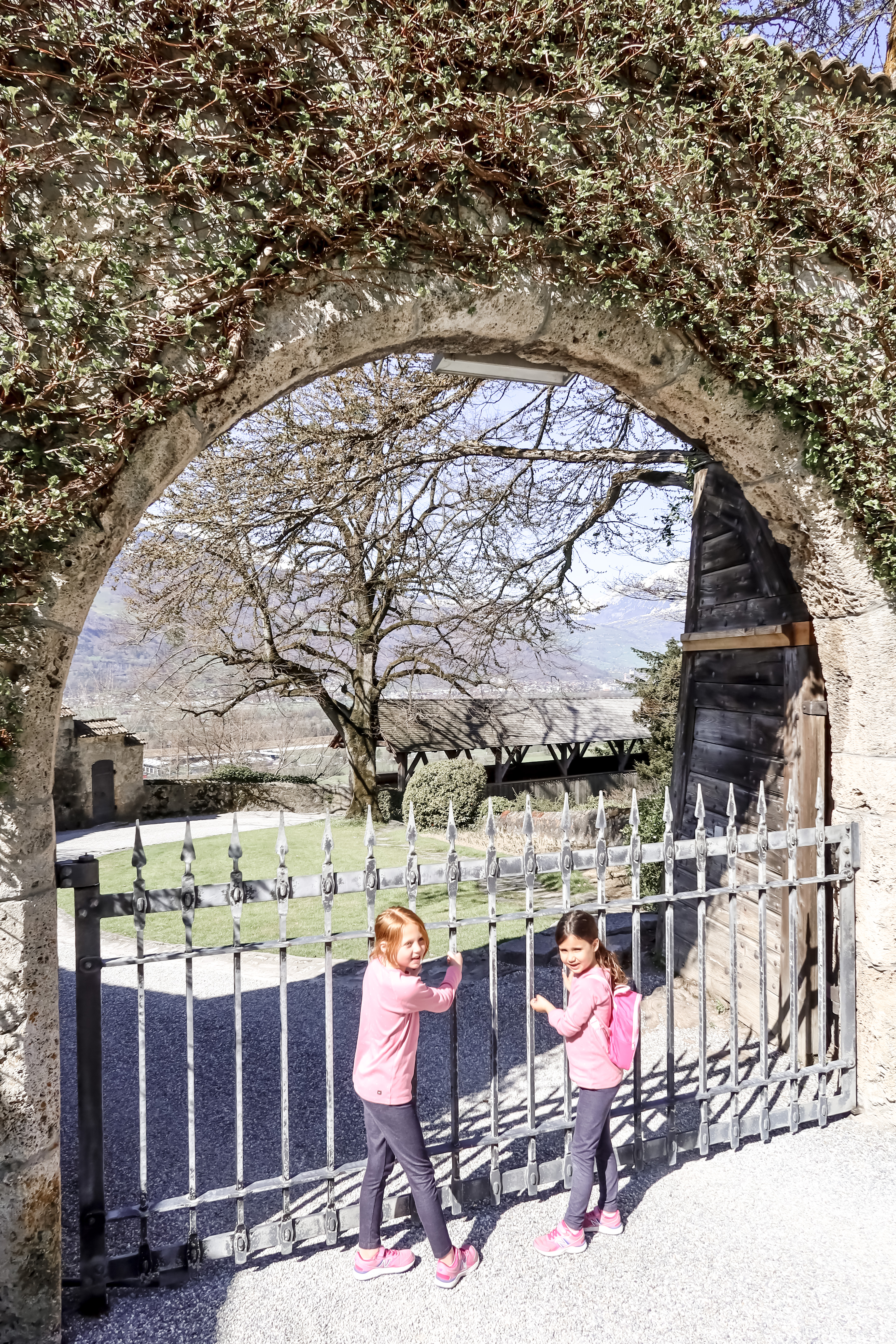 Peaking through the gates at Vaduz Castle - Liechtenstein with kids